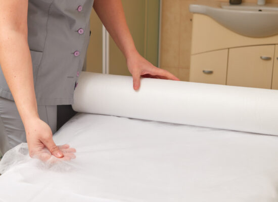 Arbemu- Medical Table Cover, woman-massage-therapist-preparing-equipment-client, supplier, manufacturer in Turkey, Turkiye